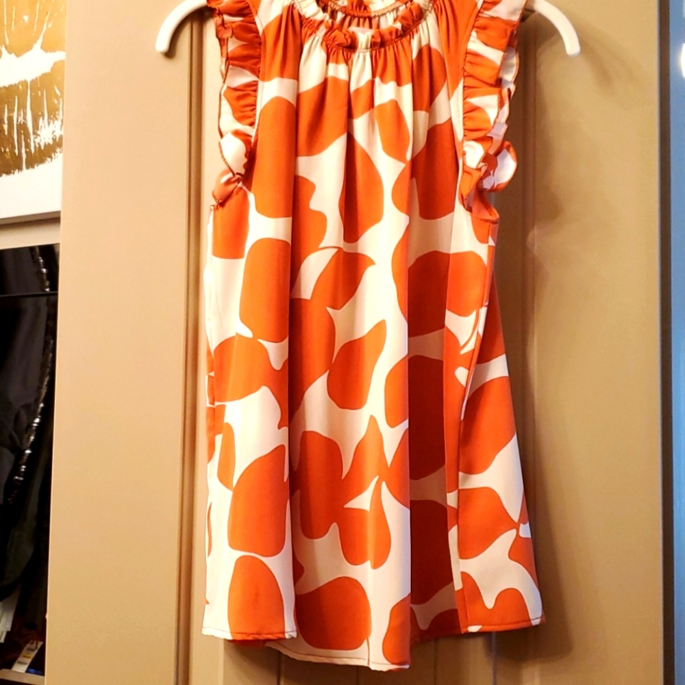 High neck top with ruffle detail on neck and sleev